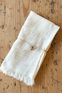 Cream cloth napkins with fringe, set of 4. 100% cotton, reusable and machine washable dinner napkins (16.5" x 16.5") perfect for everyday meals, brunch, holidays and eco-friendly table décor.