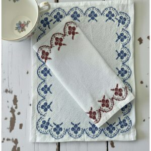 Add a touch of vintage charm to your kitchen or table with this cute retro-style cotton napkin set of four, featuring a sweet embroidered trim in blue or red. Made from 100% cotton, it’s soft, reusable, and perfect for everyday meals, tea time, picnics, or adding a pop of color to your table scape. This smaller size is especially handy as a lunch napkin, tea napkin, or dessert napkin great for brunch, coffee & pastries, or light bites. It also makes an adorable housewarming gift, hostess gift, or thoughtful add-on to a cozy eco-friendly kitchen bundle. Details: Material: 100% cotton Style: retro / vintage-inspired Trim: embroidered edge (choose blue or red) Size: 14.4" x 11.4" (small napkin size) Reusable, washable, and perfect for a low-waste home Perfect for: everyday dining, tea parties, cottage decor kitchens, farmhouse tables, lunchboxes, picnics, spring table and gift baskets.